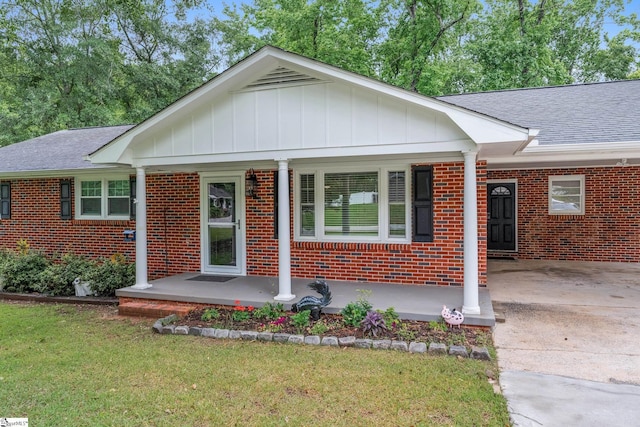 502 Hunts Bridge Rd, Greenville, SC 29617 - view of front of house featuring brick siding, driveway, and roof with shingles