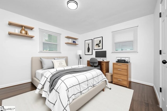 502 Hunts Bridge Rd, Greenville, SC 29617 - bedroom with baseboards and dark wood-type flooring