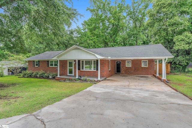 502 Hunts Bridge Rd, Greenville, SC 29617 - ranch-style house featuring a front lawn, concrete driveway, brick siding, a porch, and a shingled roof