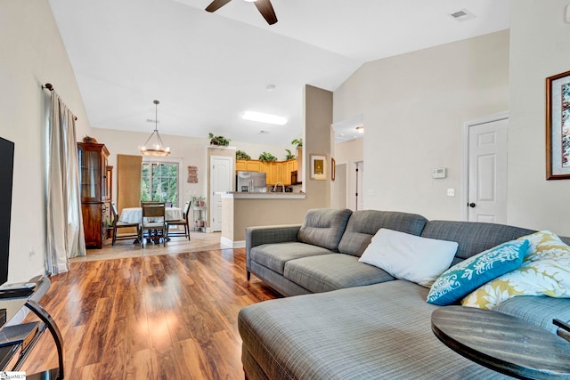 104 Penrith Ct, Simpsonville, SC 29681 - living room with ceiling fan, light wood finished floors, a chandelier, and high vaulted ceiling