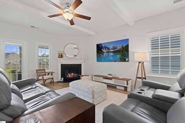 603 Betony Way, Greenville, SC 29607 - living room with beamed ceiling, light wood-style flooring, ceiling fan, a fireplace with flush hearth, and baseboards