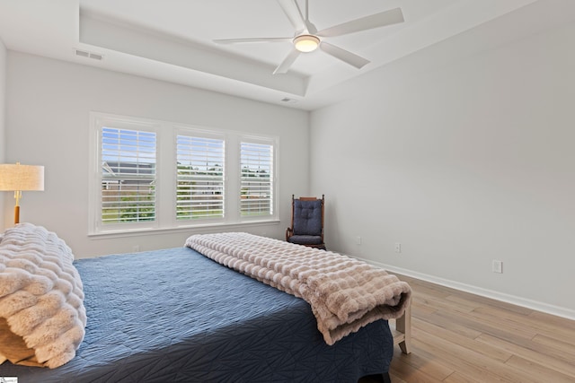 603 Betony Way, Greenville, SC 29607 - bedroom featuring light wood-style floors, a raised ceiling, baseboards, and ceiling fan