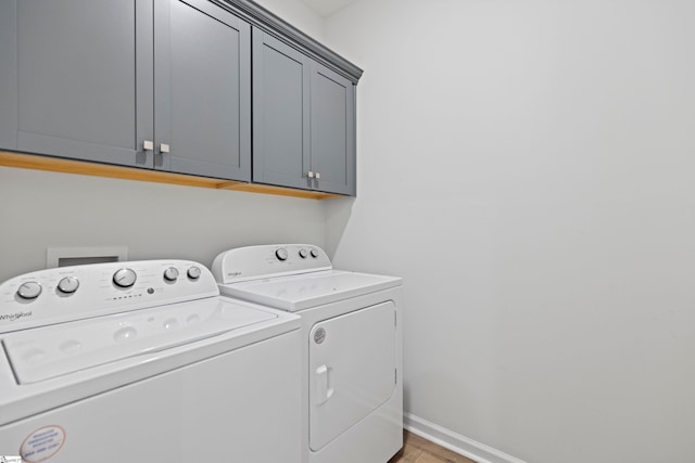 603 Betony Way, Greenville, SC 29607 - washroom featuring cabinet space, washer and dryer, light wood-style flooring, and baseboards