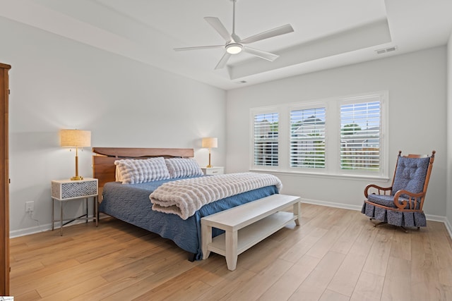 603 Betony Way, Greenville, SC 29607 - bedroom with light wood finished floors, a raised ceiling, baseboards, and a ceiling fan