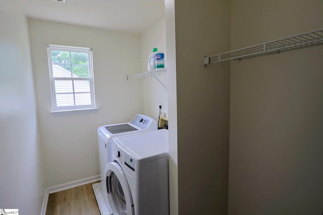 208 Catterick Way, Fountain Inn, SC 29644 - laundry room with washing machine and clothes dryer, light wood finished floors, and baseboards