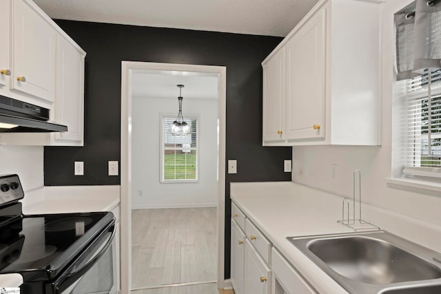 147 Highland Ridge Trl, Boiling Springs, SC 29316 - kitchen with electric stove, white cabinetry, under cabinet range hood, light wood finished floors, and light countertops