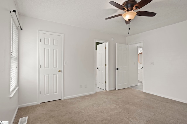147 Highland Ridge Trl, Boiling Springs, SC 29316 - unfurnished bedroom with carpet flooring, ensuite bathroom, baseboards, and a textured ceiling