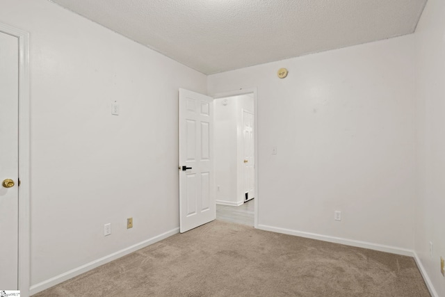 147 Highland Ridge Trl, Boiling Springs, SC 29316 - unfurnished room with carpet flooring, baseboards, a textured ceiling, and a smoke detector