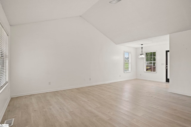 147 Highland Ridge Trl, Boiling Springs, SC 29316 - spare room with light wood-style floors, vaulted ceiling, a chandelier, and baseboards