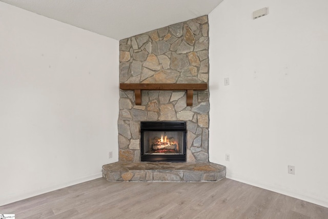 147 Highland Ridge Trl, Boiling Springs, SC 29316 - detailed view of a stone fireplace, wood finished floors, and baseboards