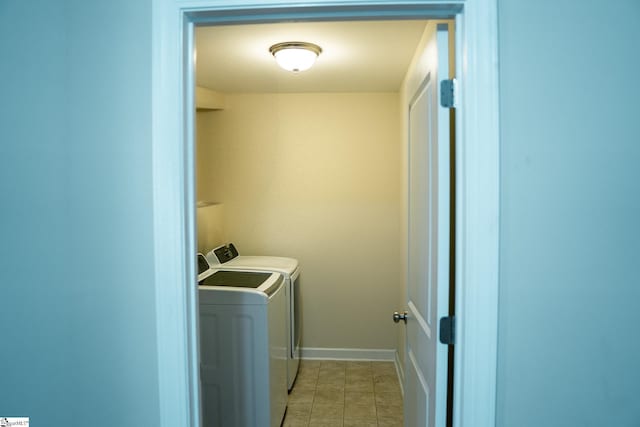 140 Belgian Blue Way, Fountain Inn, SC 29644 - washroom featuring washing machine and clothes dryer, light tile patterned floors, and baseboards
