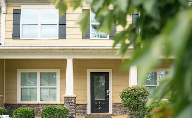 140 Belgian Blue Way, Fountain Inn, SC 29644 - property entrance with stone siding and a porch