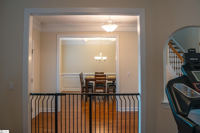 140 Belgian Blue Way, Fountain Inn, SC 29644 - dining room with arched walkways, a chandelier, crown molding, and stairs