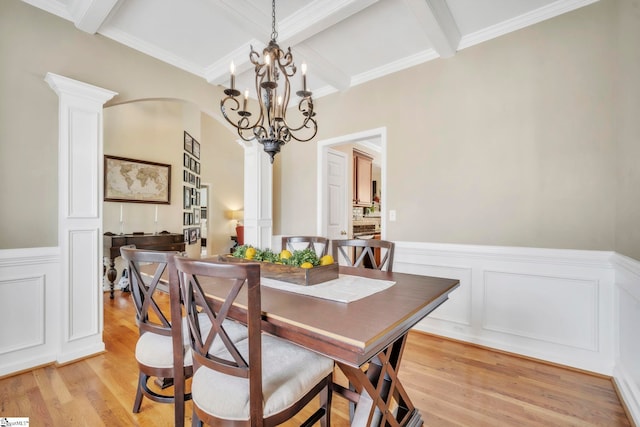 721 Dutchman Ct, Greer, SC 29651 - dining space with a decorative wall, beamed ceiling, a chandelier, coffered ceiling, and arched walkways