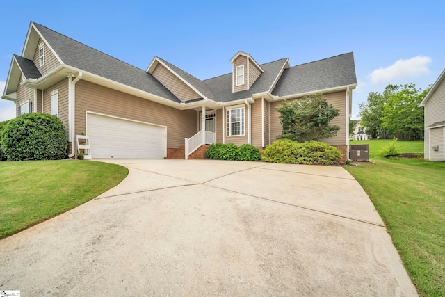 721 Dutchman Ct, Greer, SC 29651 - view of front facade featuring concrete driveway, a front yard, a shingled roof, an attached garage, and central AC unit