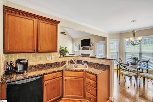 721 Dutchman Ct, Greer, SC 29651 - kitchen featuring black dishwasher, a sink, a peninsula, light wood-style flooring, and a chandelier