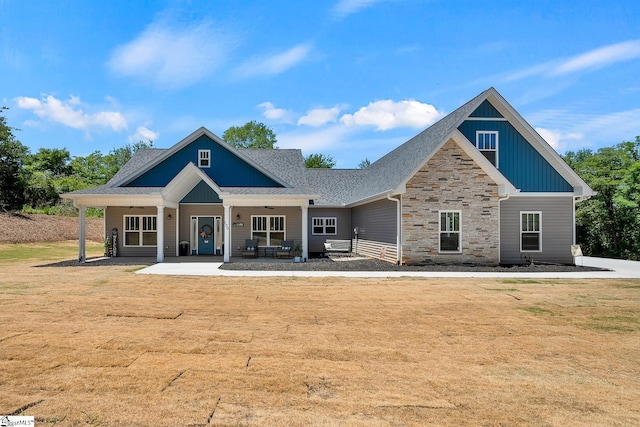 100 Grandview Dr, Anderson, SC 29625 - rear view of property with stone siding, board and batten siding, ceiling fan, a shingled roof, and a yard