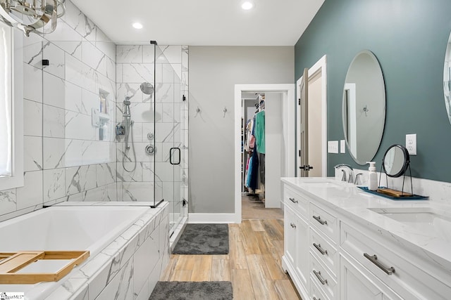 100 Grandview Dr, Anderson, SC 29625 - bathroom featuring a shower stall, a garden tub, wood finished floors, double vanity, and recessed lighting