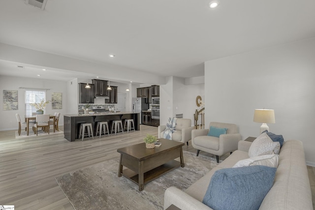 202 Walla Walla Ct, Greenville, SC 29607 - living area with light wood-style floors, baseboards, and recessed lighting