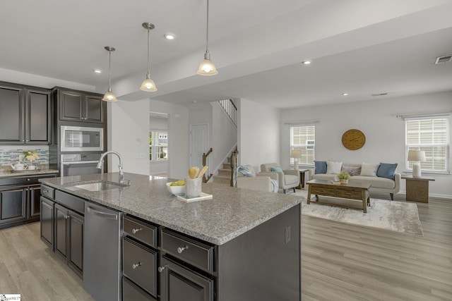 202 Walla Walla Ct, Greenville, SC 29607 - kitchen with appliances with stainless steel finishes, a sink, healthy amount of natural light, light wood finished floors, and recessed lighting
