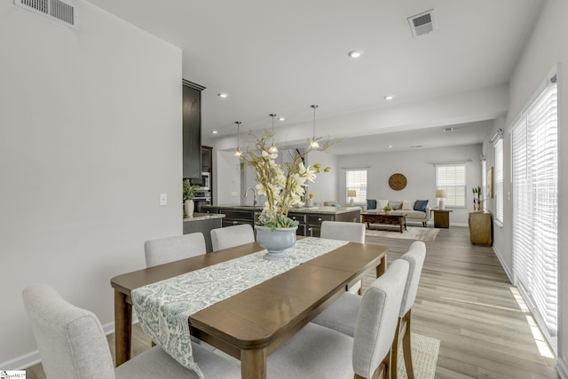 202 Walla Walla Ct, Greenville, SC 29607 - dining space with recessed lighting, healthy amount of natural light, light wood-type flooring, and baseboards