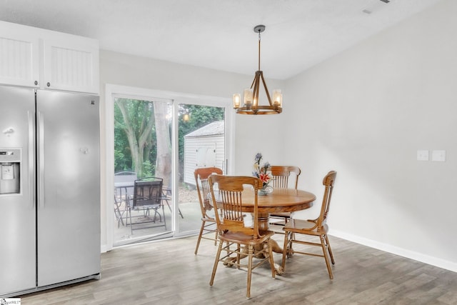 113 Sedgefield Ct, Anderson, SC 29621 - dining area with light wood-style floors, a chandelier, and baseboards