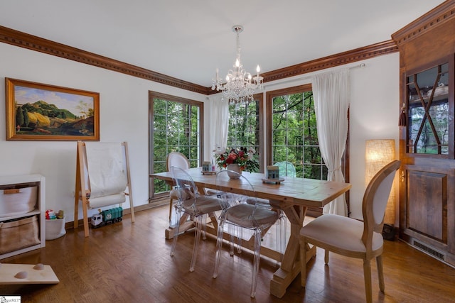 304 Oak Brook Way, Taylors, SC 29687 - dining room featuring a chandelier, wood finished floors, ornamental molding, and baseboards