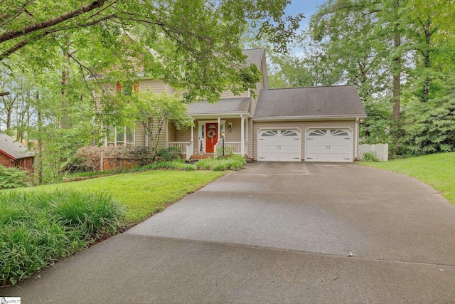 304 Oak Brook Way, Taylors, SC 29687 - view of front of house with driveway, a porch, a garage, and a front yard