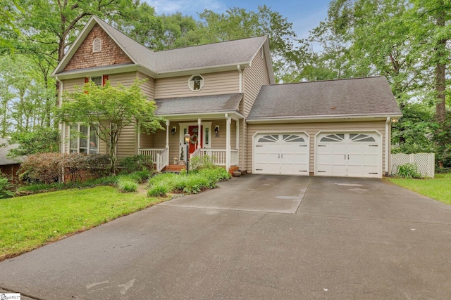 304 Oak Brook Way, Taylors, SC 29687 - view of front of home featuring an attached garage, a porch, a front yard, concrete driveway, and a shingled roof