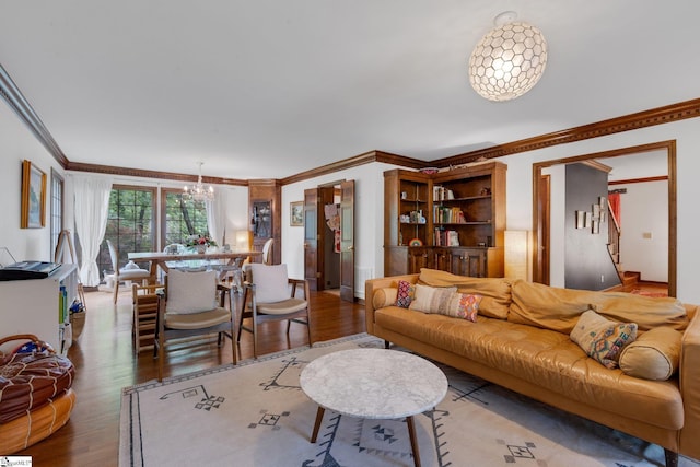 304 Oak Brook Way, Taylors, SC 29687 - living room featuring a chandelier, crown molding, wood finished floors, and stairs