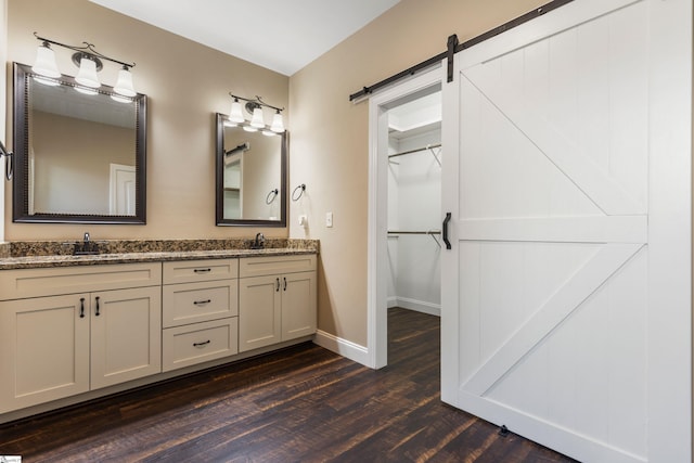 121 Floyd Meadow Dr, Inman, SC 29349 - full bath with wood finished floors, double vanity, baseboards, and a walk in closet