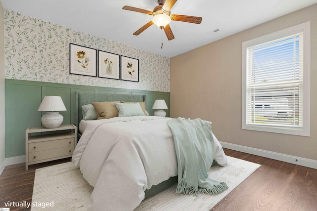 121 Floyd Meadow Dr, Inman, SC 29349 - bedroom featuring wallpapered walls, multiple windows, wainscoting, baseboards, and wood finished floors