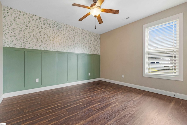 121 Floyd Meadow Dr, Inman, SC 29349 - unfurnished room with wallpapered walls, wainscoting, dark wood-type flooring, a ceiling fan, and baseboards