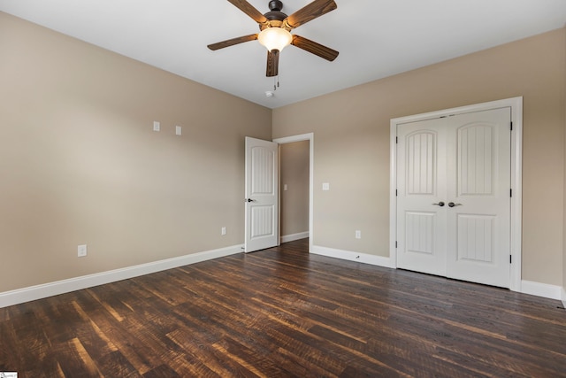 121 Floyd Meadow Dr, Inman, SC 29349 - unfurnished bedroom featuring dark wood-style flooring, baseboards, a closet, and a ceiling fan