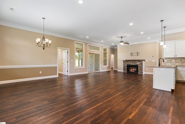 121 Floyd Meadow Dr, Inman, SC 29349 - unfurnished living room with a stone fireplace, dark wood-style flooring, ceiling fan, ornamental molding, and recessed lighting