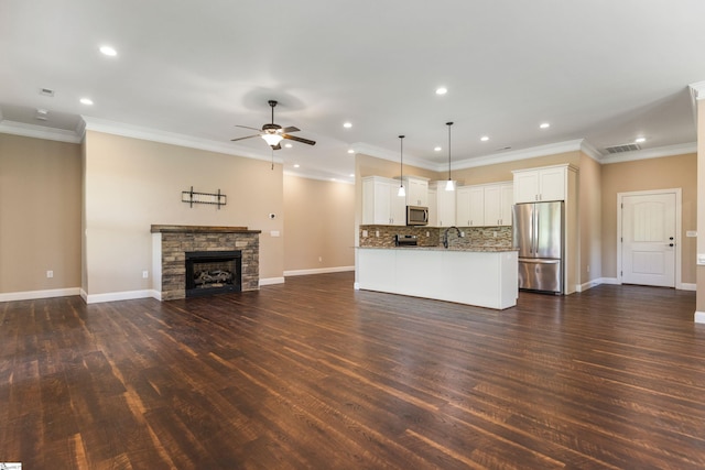 121 Floyd Meadow Dr, Inman, SC 29349 - unfurnished living room with a ceiling fan, baseboards, dark wood finished floors, recessed lighting, and ornamental molding