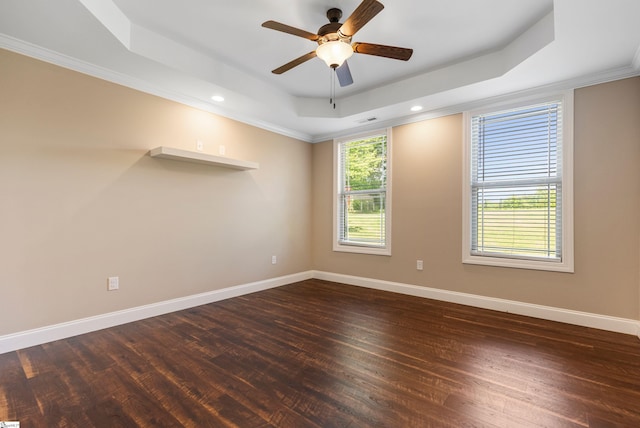 121 Floyd Meadow Dr, Inman, SC 29349 - empty room featuring a tray ceiling, dark wood-type flooring, baseboards, a ceiling fan, and crown molding