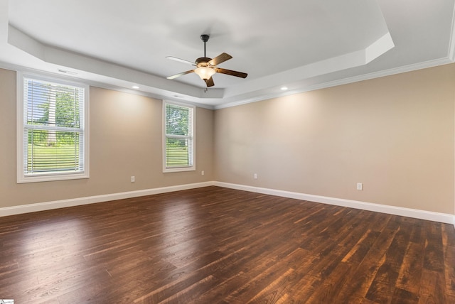 121 Floyd Meadow Dr, Inman, SC 29349 - spare room featuring a raised ceiling, plenty of natural light, ceiling fan, dark wood-style floors, and crown molding