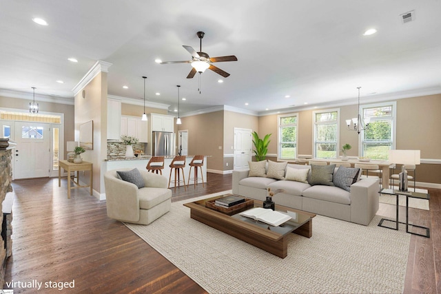 121 Floyd Meadow Dr, Inman, SC 29349 - living area featuring baseboards, dark wood-style flooring, recessed lighting, crown molding, and a chandelier