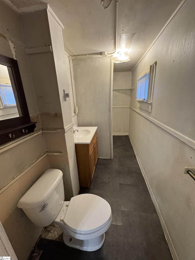 12 Stevens St, Laurens, SC 29360 - bathroom featuring toilet, vanity, and plenty of natural light