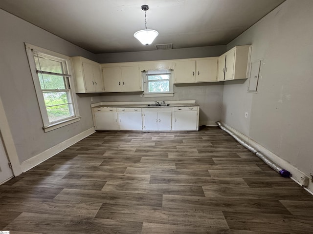 12 Stevens St, Laurens, SC 29360 - kitchen featuring a sink, healthy amount of natural light, and white cabinetry