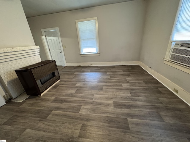 12 Stevens St, Laurens, SC 29360 - unfurnished living room featuring dark wood-style floors and baseboards