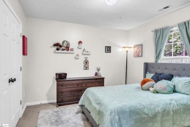 137 Mediterranean Ave, Anderson, SC 29621 - carpeted bedroom featuring a textured ceiling and baseboards
