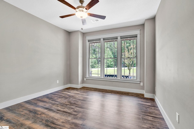 1061 Hidden Glory Dr, Landrum, SC 29356 - empty room with dark wood finished floors, ceiling fan, and baseboards