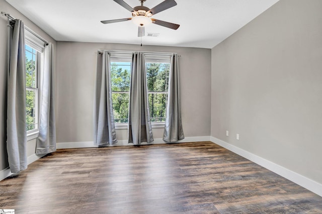 1061 Hidden Glory Dr, Landrum, SC 29356 - empty room featuring plenty of natural light, ceiling fan, baseboards, and wood finished floors