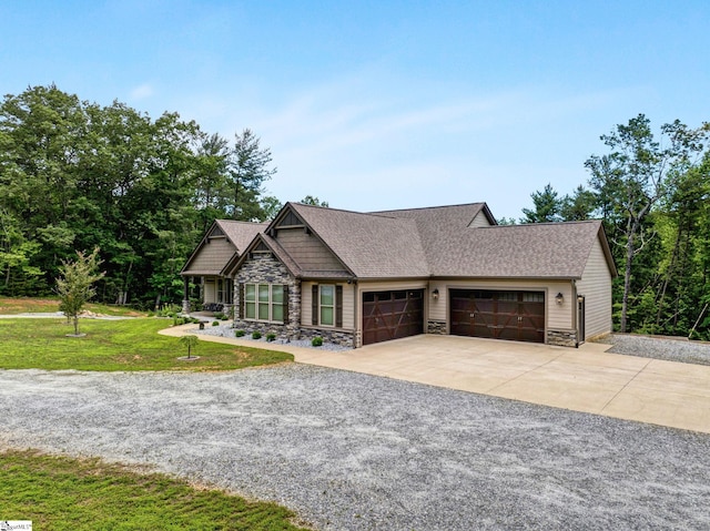 1061 Hidden Glory Dr, Landrum, SC 29356 - craftsman-style house featuring stone siding, an attached garage, concrete driveway, and a front yard
