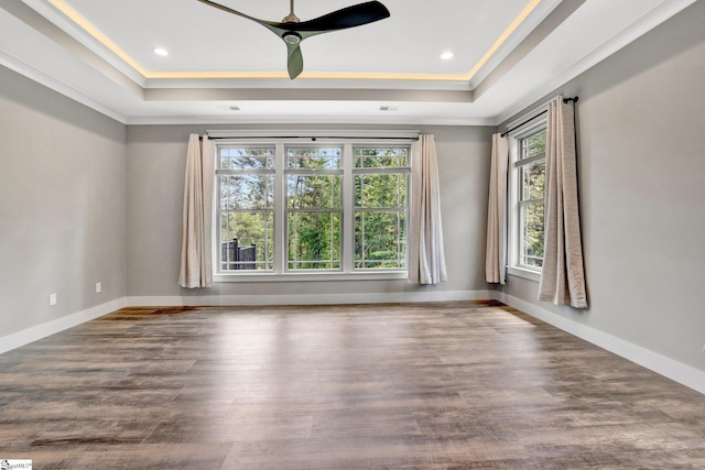 1061 Hidden Glory Dr, Landrum, SC 29356 - unfurnished room with a raised ceiling, crown molding, wood finished floors, a ceiling fan, and recessed lighting