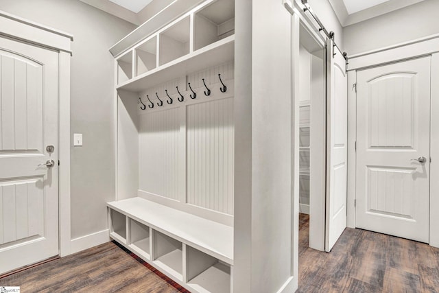 1061 Hidden Glory Dr, Landrum, SC 29356 - mudroom with dark wood-style floors, a barn door, and baseboards