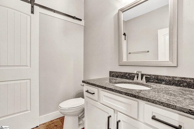1061 Hidden Glory Dr, Landrum, SC 29356 - half bath featuring vanity, toilet, and baseboards