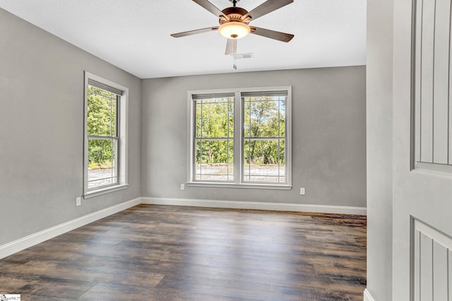1061 Hidden Glory Dr, Landrum, SC 29356 - spare room with dark wood-style flooring, a ceiling fan, and baseboards